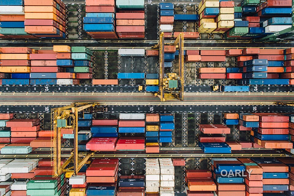 Organised container freight operations supporting commercial product supply